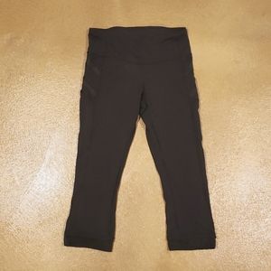 Lululemon capri leggings with sheer detailing, pockets size 4